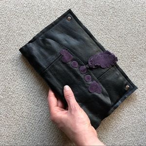 Black leather clutch with leather hearts, tassels